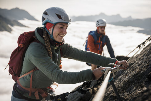 Safe via ferrata climbing requires experience in attaching safety carabiners